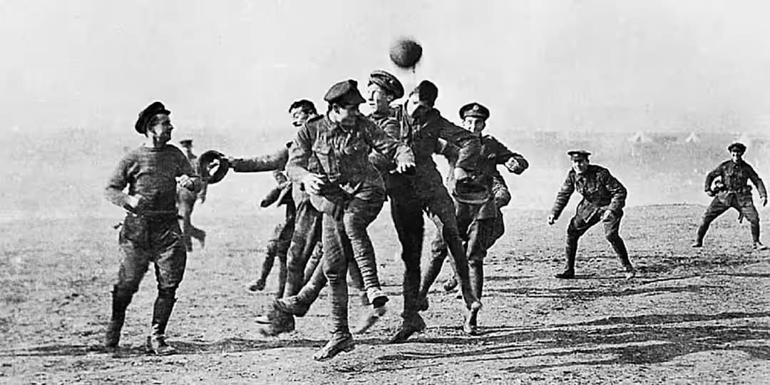 Soldiers playing soccer in No-Man's Land a year after the Christmas Truce in 1914. Credit: Universal History Archive/UIG/Getty Images